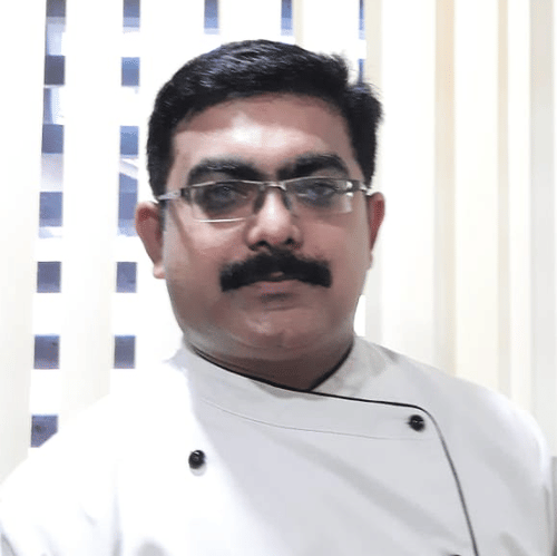 Chef Arundev wearing chef's whites at Uday Suites