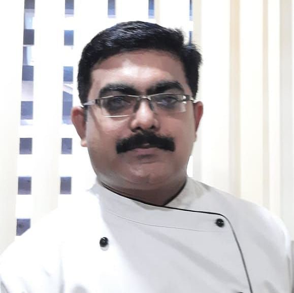Chef Arundev wearing chef's whites at Uday Suites