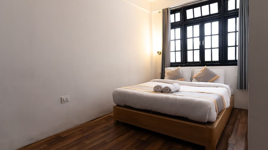 view of the comfort room with large bed and a window in the background at Mystique Valley Resort  
