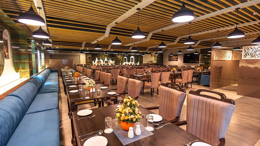 tables and chair seating arrangement in the restaurant - The Bridge