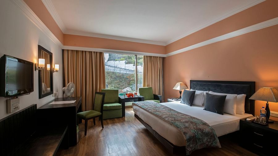 Premier Room with a bed overlooking a window at Mastiff Grand, Manali