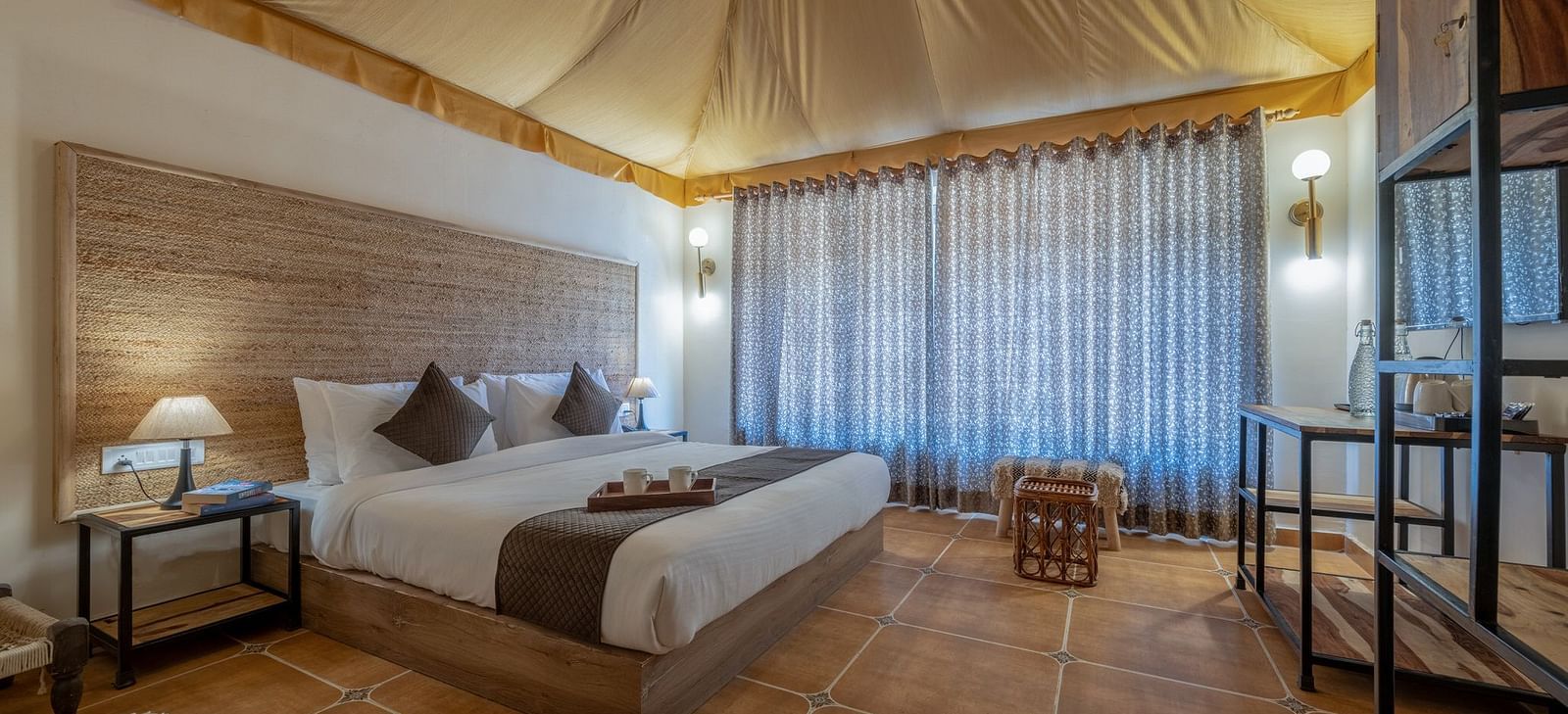 Side view of an accommodation with a bed and a tented ceiling at Valley by Grassfield.