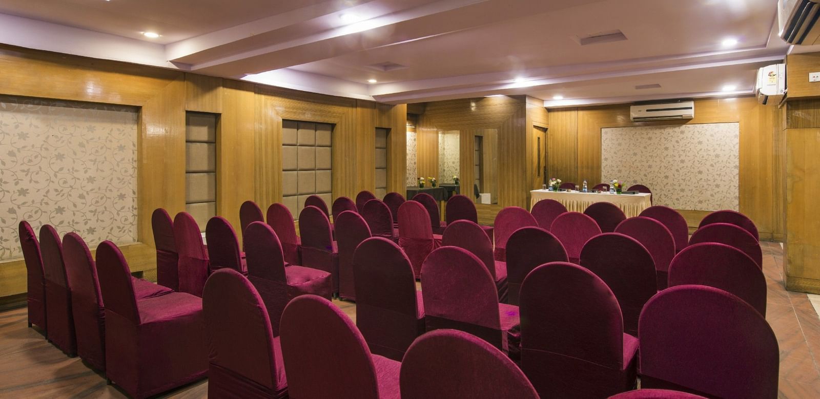 Conference room at Lords Eco Inn Dahej with theatre-style seating and modern presentation setup.