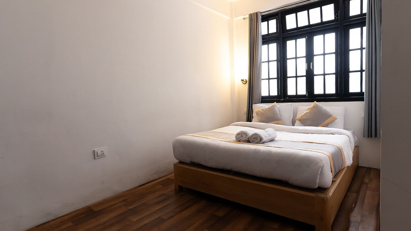 view of the comfort room with large bed and a window in the background at Mystique Valley Resort  