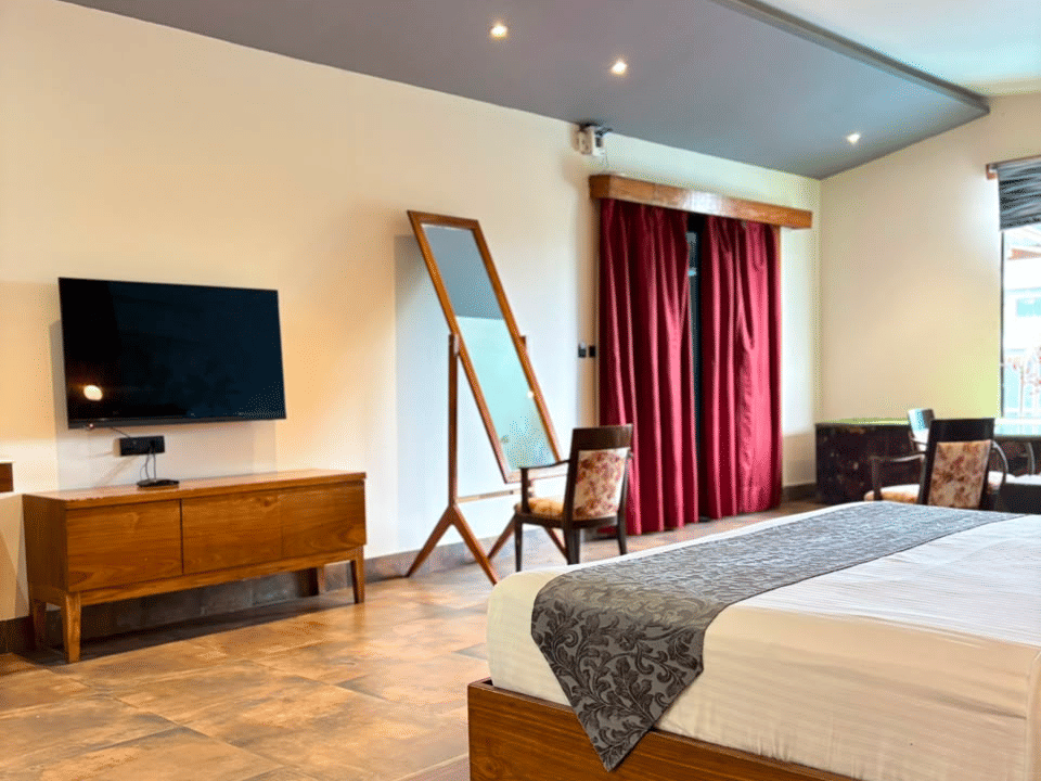 Skyline by Miraya, Emperor Suite, Television console facing the king bed