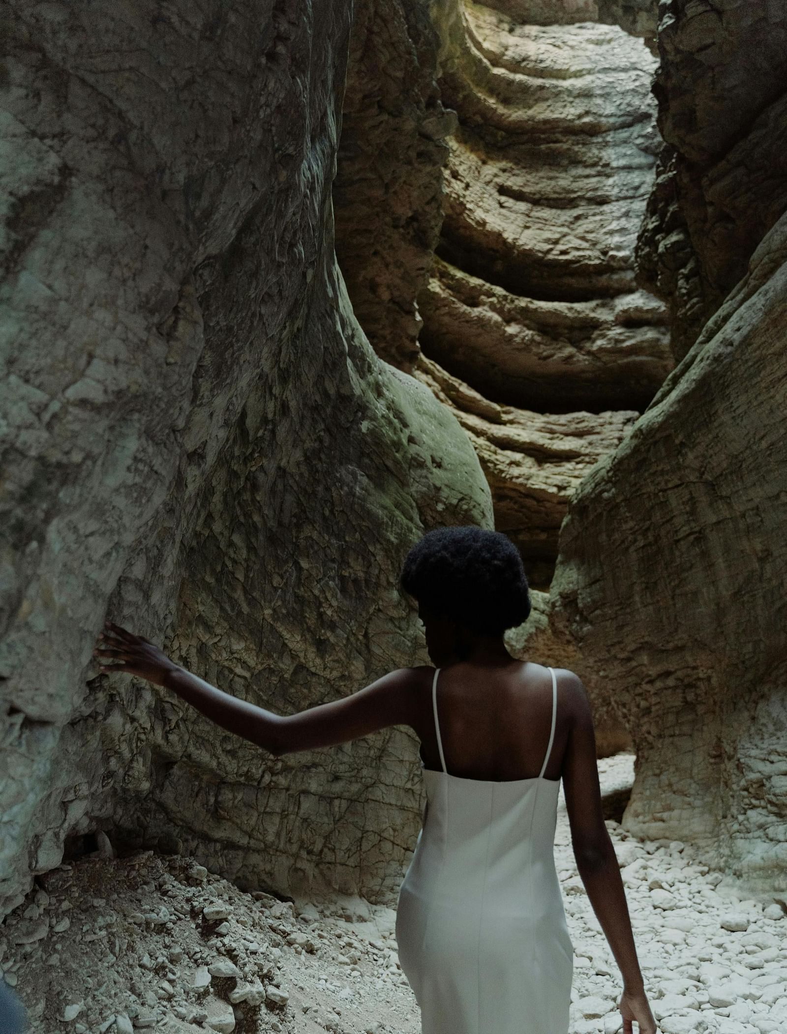 A person looking at the interiors of Black Chasm Cavern.