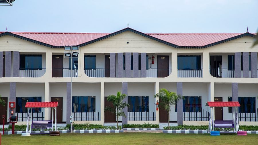  A close up image of the resort complex featuring various rooms with the lawn in front of it - VITS Select Diamond Resort, Sasan Gir