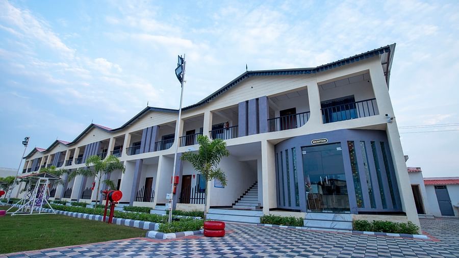 A clear view of the resort’s exterior, with clean pathways, modern architecture, and plants around the building - VITS Select Diamond Resort, Sasan Gir