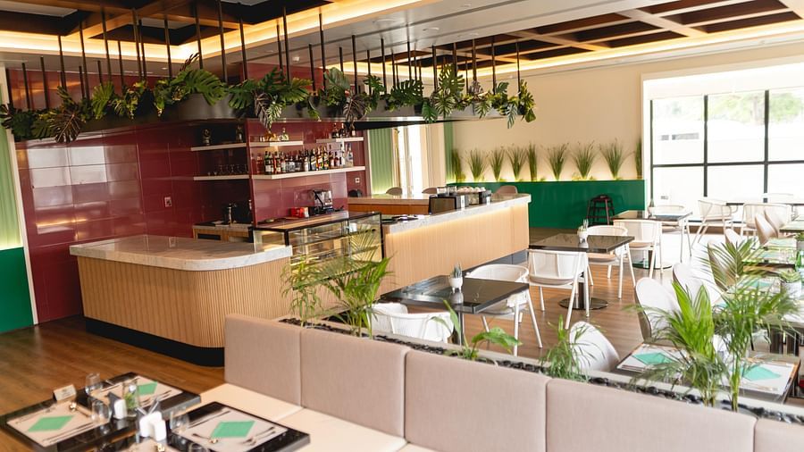 Meli-Melo Restaurant at KertelSuites, featuring elegant seating arrangements and stylish ceiling lights