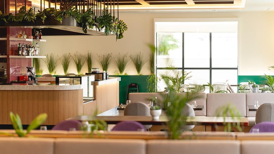 Meli-Melo Restaurant at KertelSuites, featuring elegant seating arrangements and stylish ceiling lights