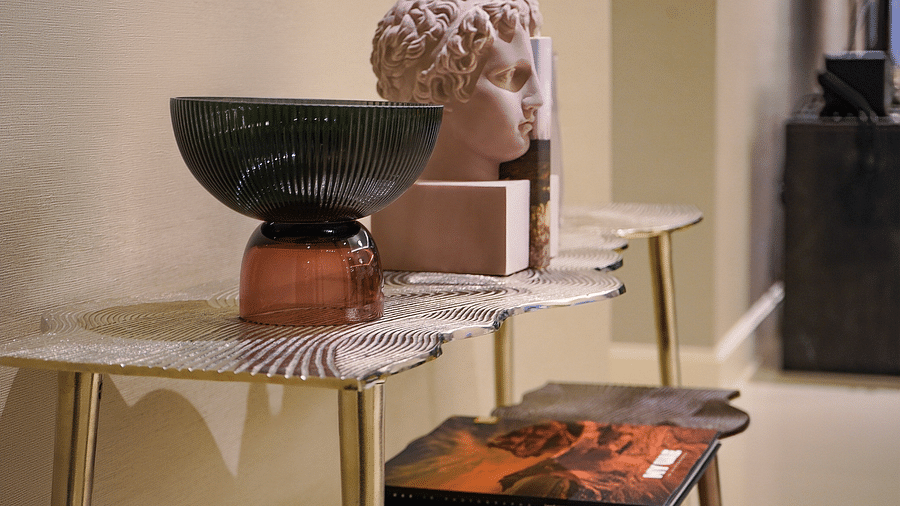 Address Fountain Views Residence Tower - a corner table with statues and decorative items kept on top of it