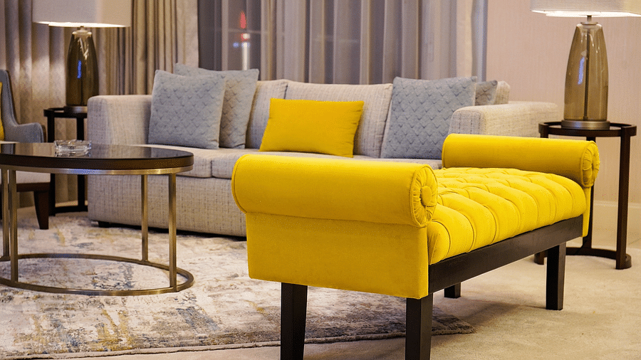 Address Fountain Views Residence Tower - a yellow sofa along with grey sofa sets and a centre table in the living room