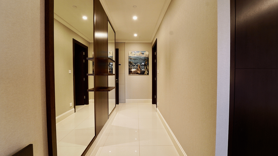 Address Fountain Views Residence Tower - the hallway area of the apartment with a wall painting hanging on the front wall