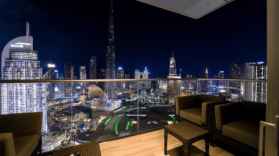 Address Fountain Views Residence Tower - view of Dubai during nighttime from the seats kept in the balcony