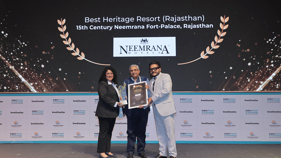 Representatives of Neemrana Hotels receive an award certificate and trophy for Best Heritage Resort (Rajasthan) awarded to Neemrana Fort-Palace at the Indian Travel Technology Summit Awards 2026.