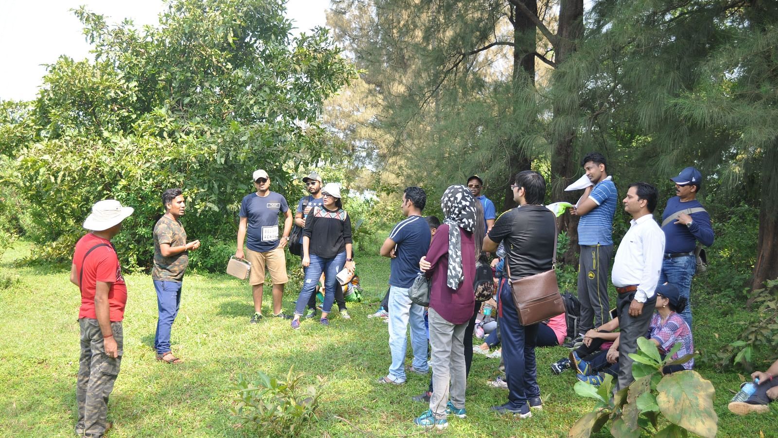 Team-building exercises at Forest Escape take place in the wooded surroundings, as a group engages in an activity.