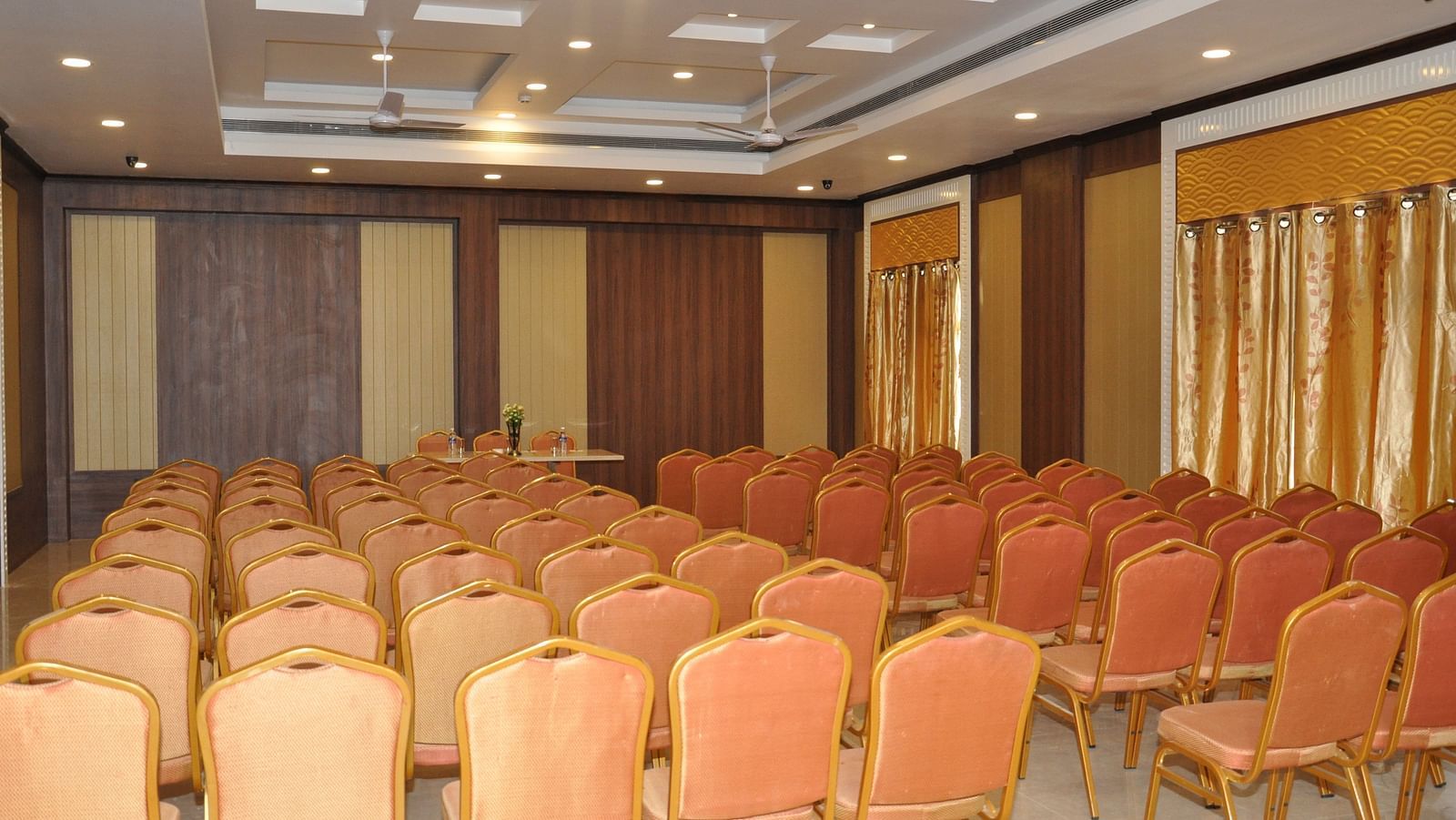 event halls with red chairs at Hotel Alps Residency, Krishnagiri