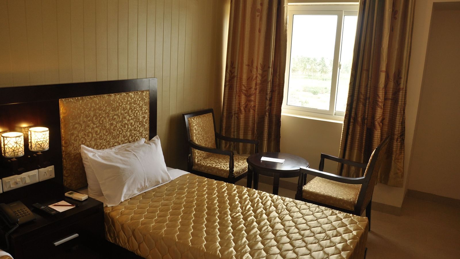 view of a twin beds of a room at Hotel Alps Residency, Krishnagiri