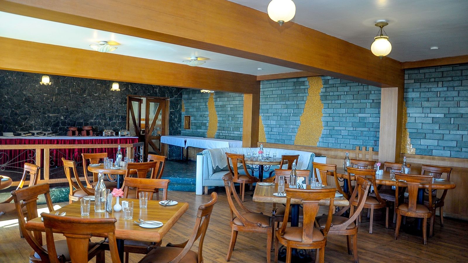 an elaborate seating arrangement at our multi-cuisine restaurant at La Montana By TGI, Ooty