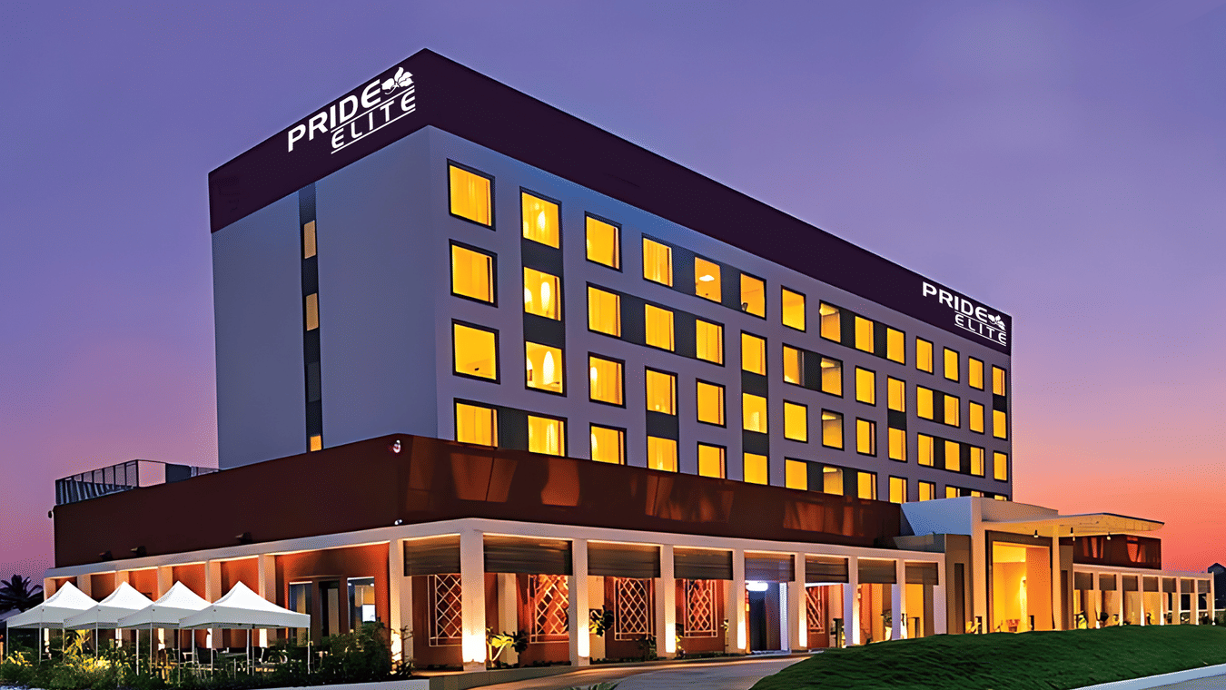 A facade image of the Pride Elite Phaltan with a dusky sky in the background