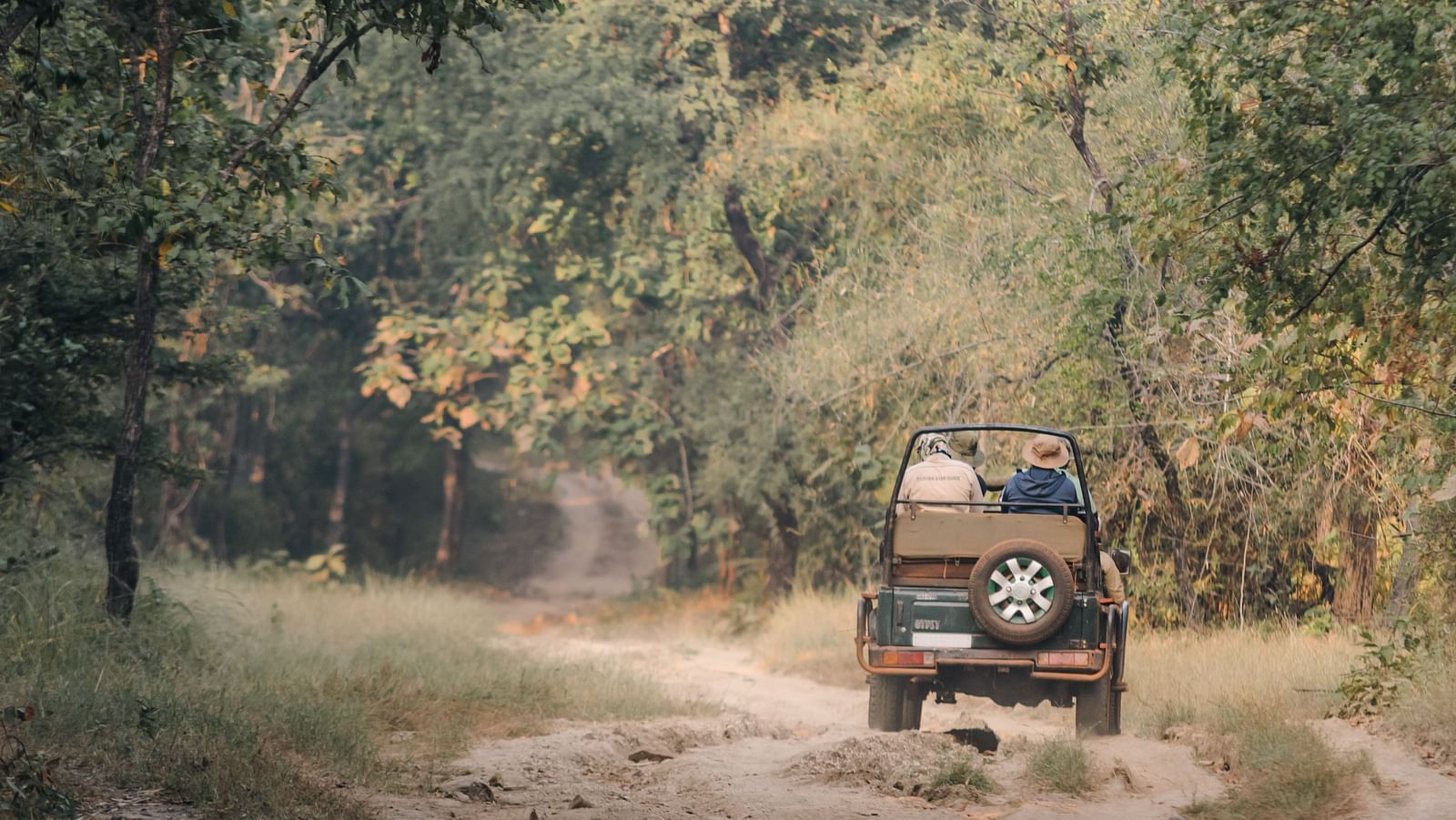 A Jeep travelling on a mud road on a safari ride at Trees N Tigers, Tadoba.