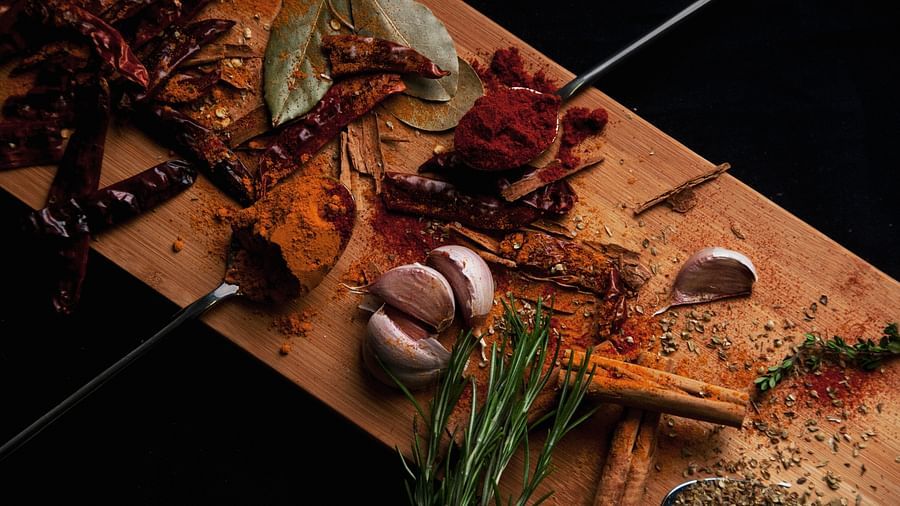 a platter of spices and raw vegetables