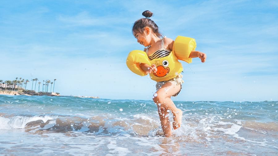 a girl playing on the beach