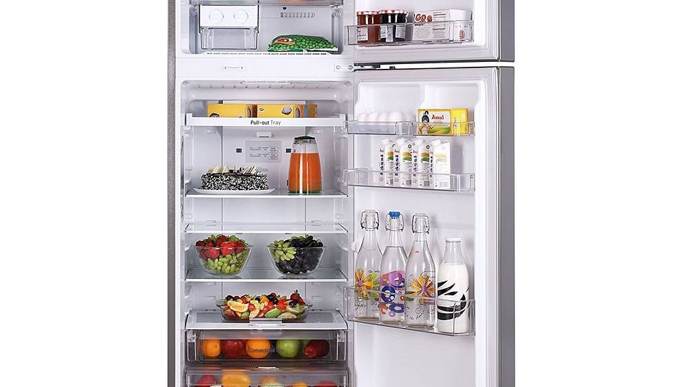 Image of a fridge filled with a variety of food.