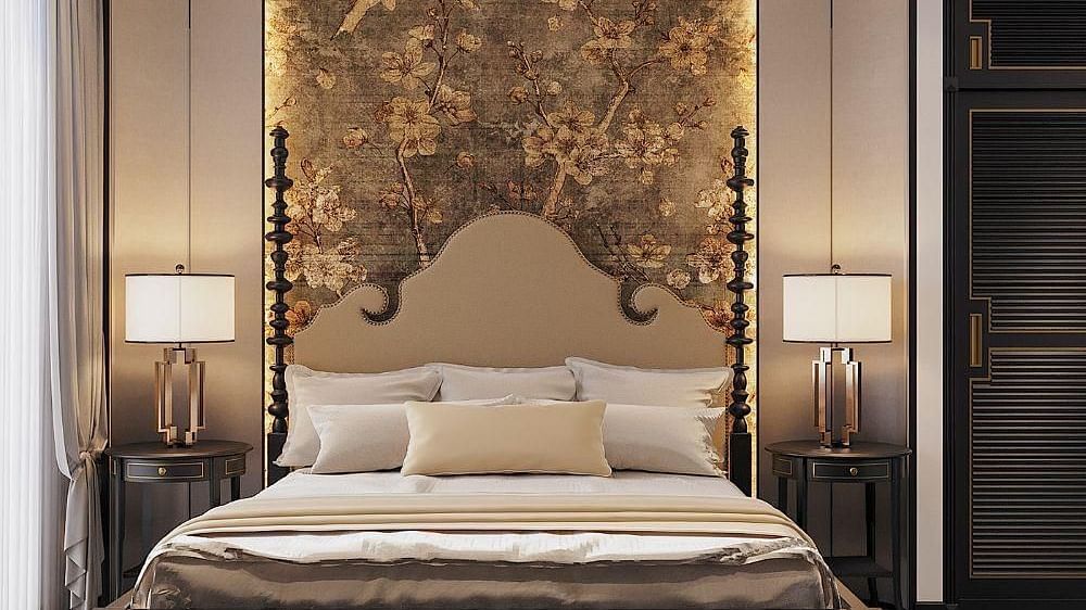 Front view of a well-made bed with cushions, a ceiling fan, and two bedside tables with lamps at The Evren, Vagator.