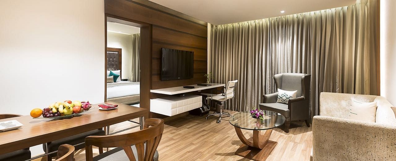 Living Room of Deluxe Suite at Grand Chennai By GRT Hotels.