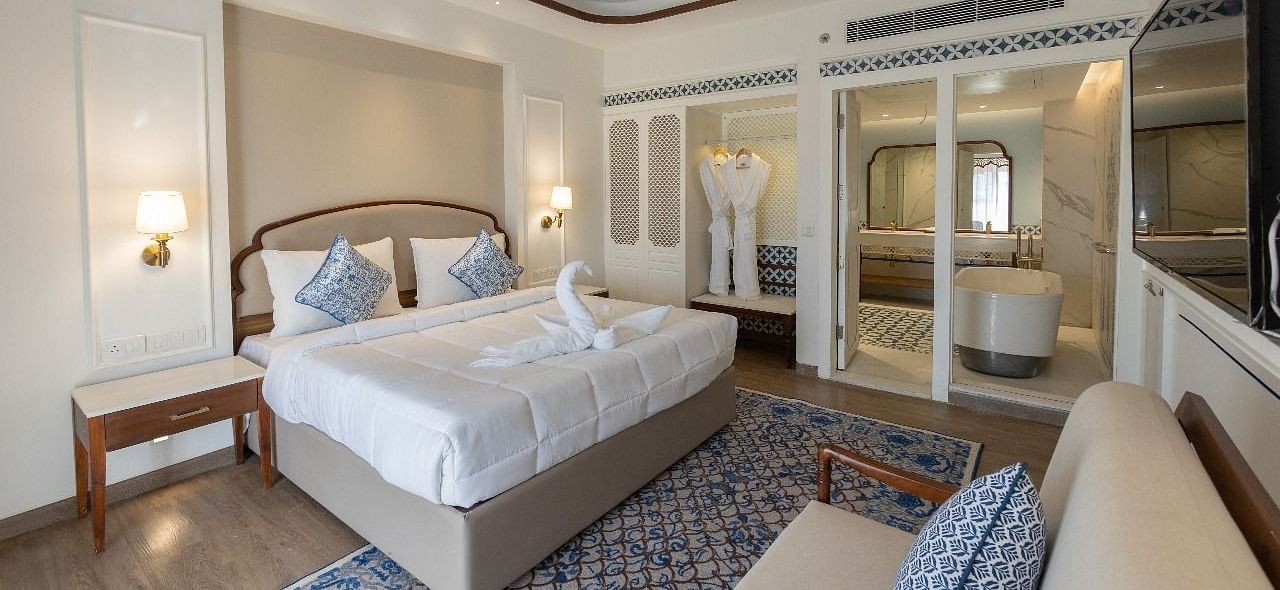 Full view shot of the luxurious bedroom at Ananta with ample of natural lighting at Bhagirathi by RDB Atishay.