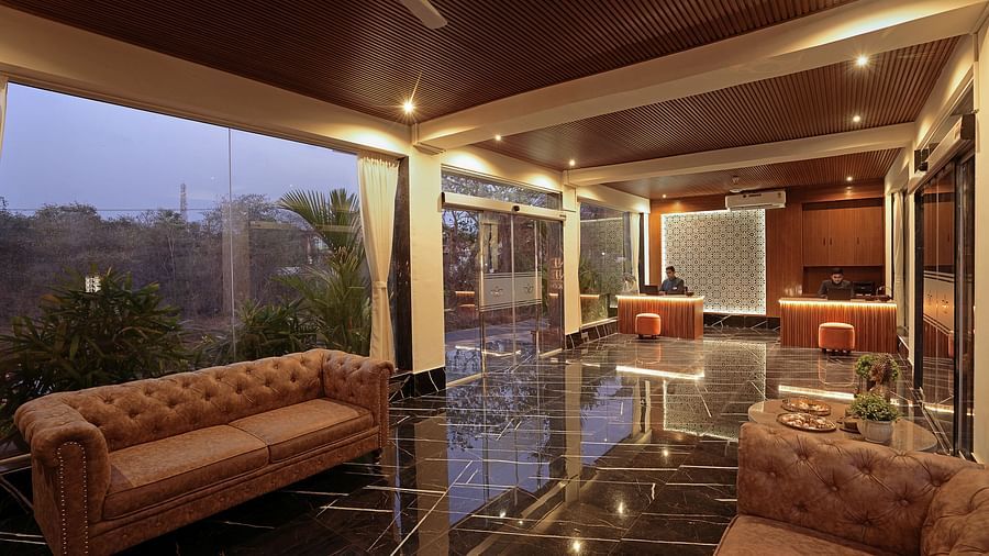 Corner view of the seating area with greenery view at Grand Continent, Anjuna - A Sarovar Portico Affiliate Hotel 