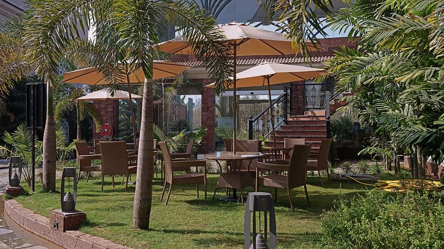 Exterior view of the property with open umbrella -Grand Continent, Anjuna - A Sarovar Portico Affiliate Hotel 
