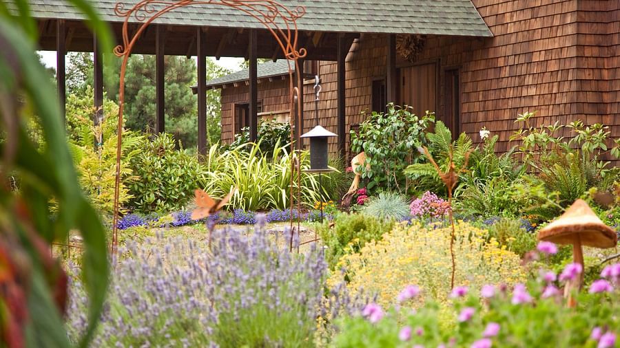 The entrance to Brewery Gulch Inn & Spa with beautiful garden in full bloom