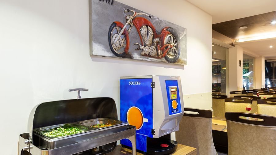 Image of a table with vegetables and a tea machine on the side at Calux Grand Baga.