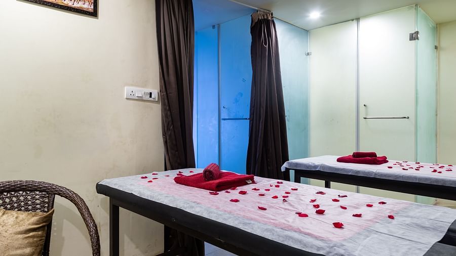 Image of room with two beds decorated with flower petals at Calux Grand Baga.