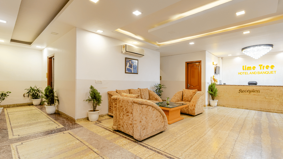 Spacious hotel reception lobby with seating area and contemporary décor.
