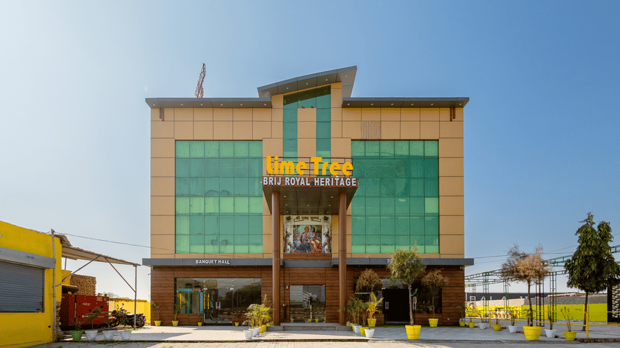 Facade image of the Lime Tree Hotels and Banquet Vrindavan on a bright sunny day