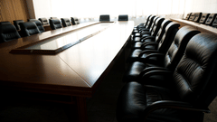 a conference hall at Purple beds by VITS, Surat with hardwood conference table