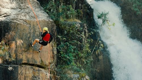 A person participating in a rock climbing activity