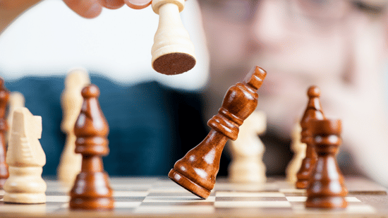 guy with glasses playing chess