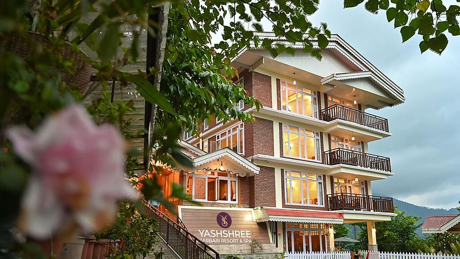 a beautiful facade image of the Yashshree Karbari Resort & Spa, Yangang with cloudy overcast skies in the background