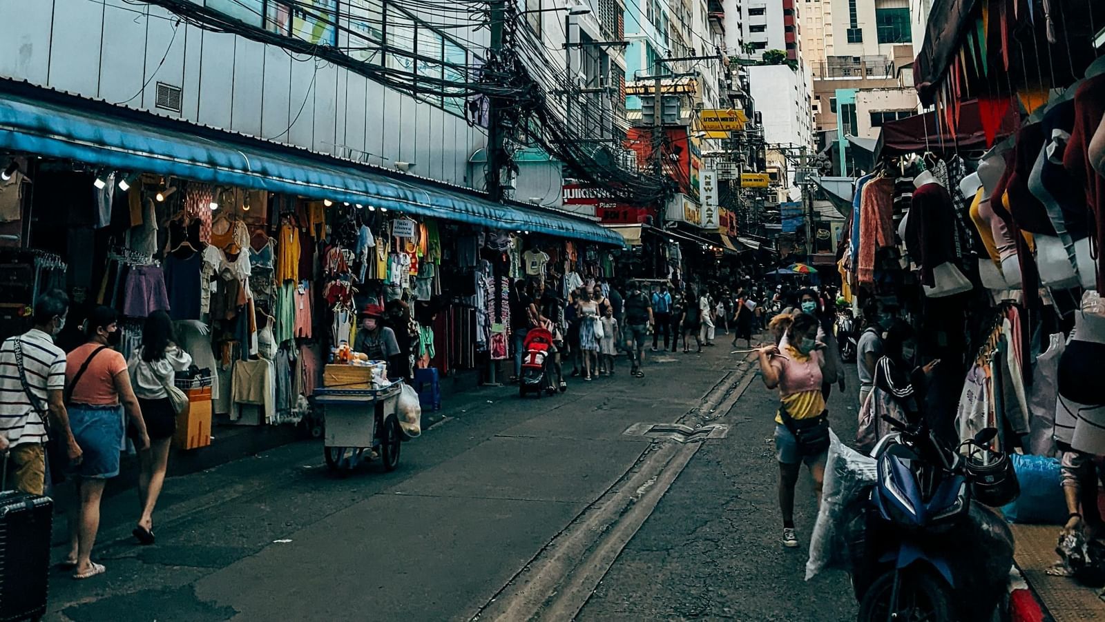 A street lined on both sides by shops.