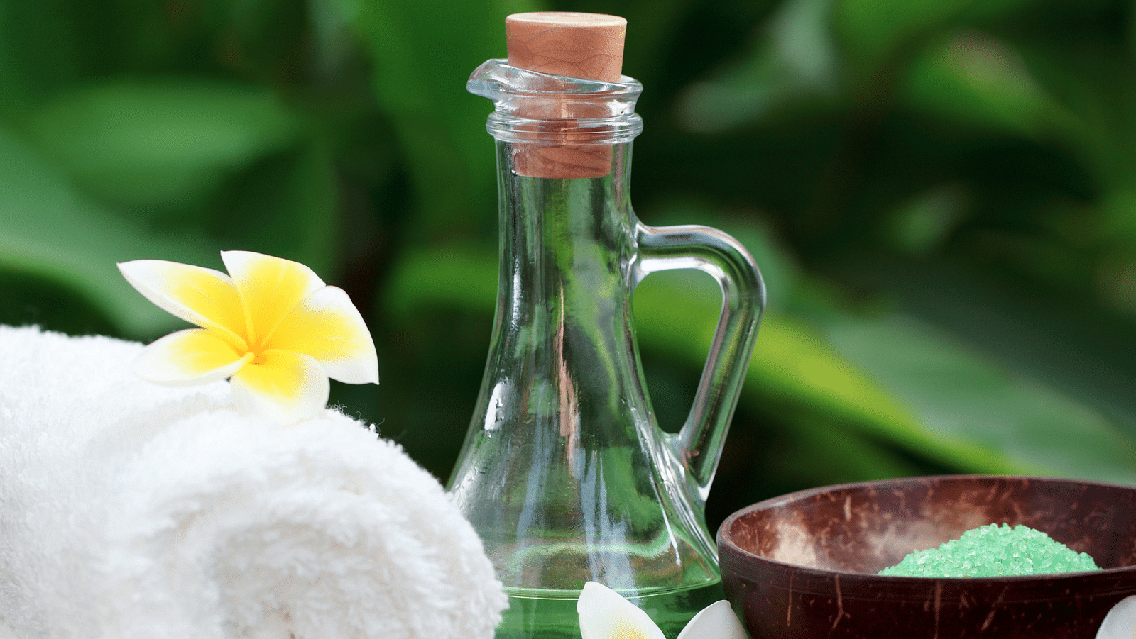 an image of  rolled up towel and a glass jar symbolises wellness - Rhythm Lonavala