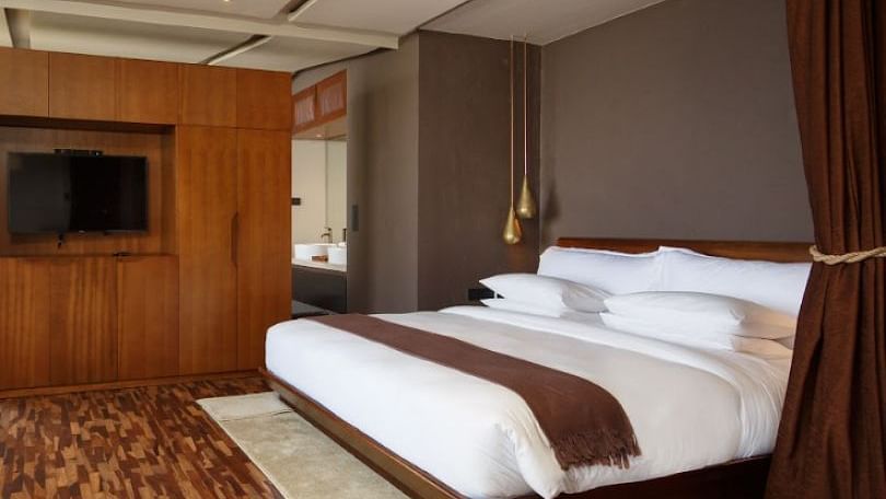 An image of a bedroom which also had a flat TV screen on the wall | Kavya Resort and Spa, Nagarkot