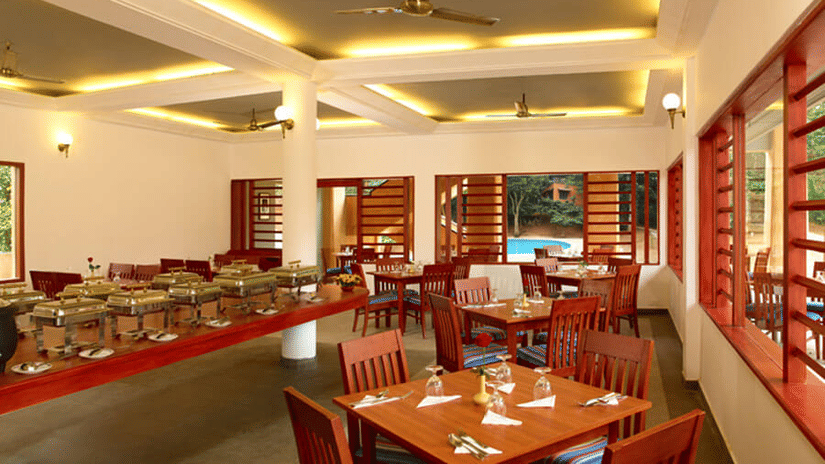 An overview of the seating arrangement inside Peppermint the in-house restaurant - Abad Green Forest, Thekkady - A Forest Resort in Kerala.