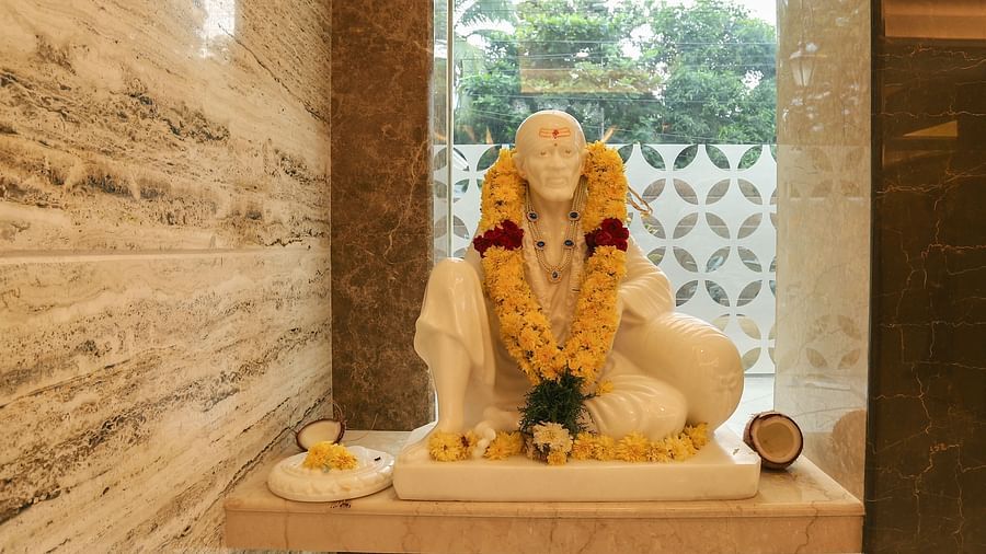 A statue of the Hindu deity Sai Baba - Hotel in T Nagar, Chennai 