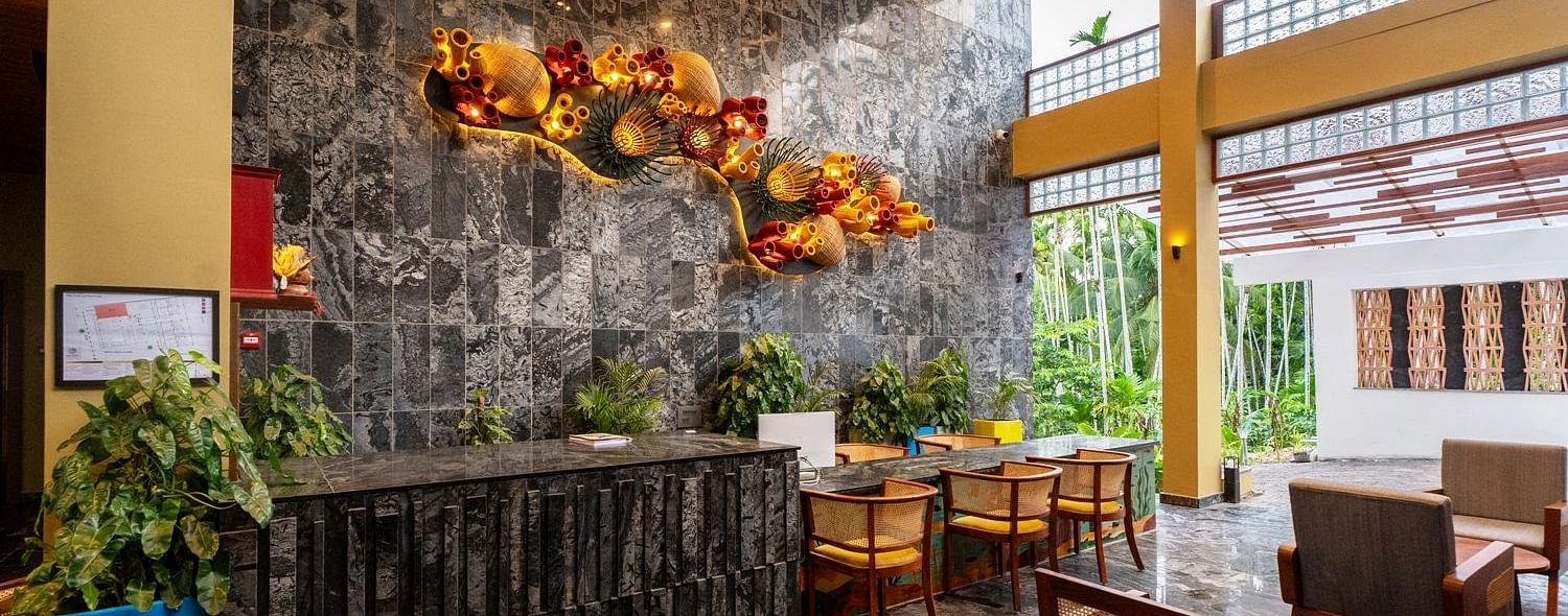 A contemporary hotel interior featuring unique lighting fixtures, stone walls, and seating arrangements. - Sea Hills Resort, Swaraj Dweep (Havelock)