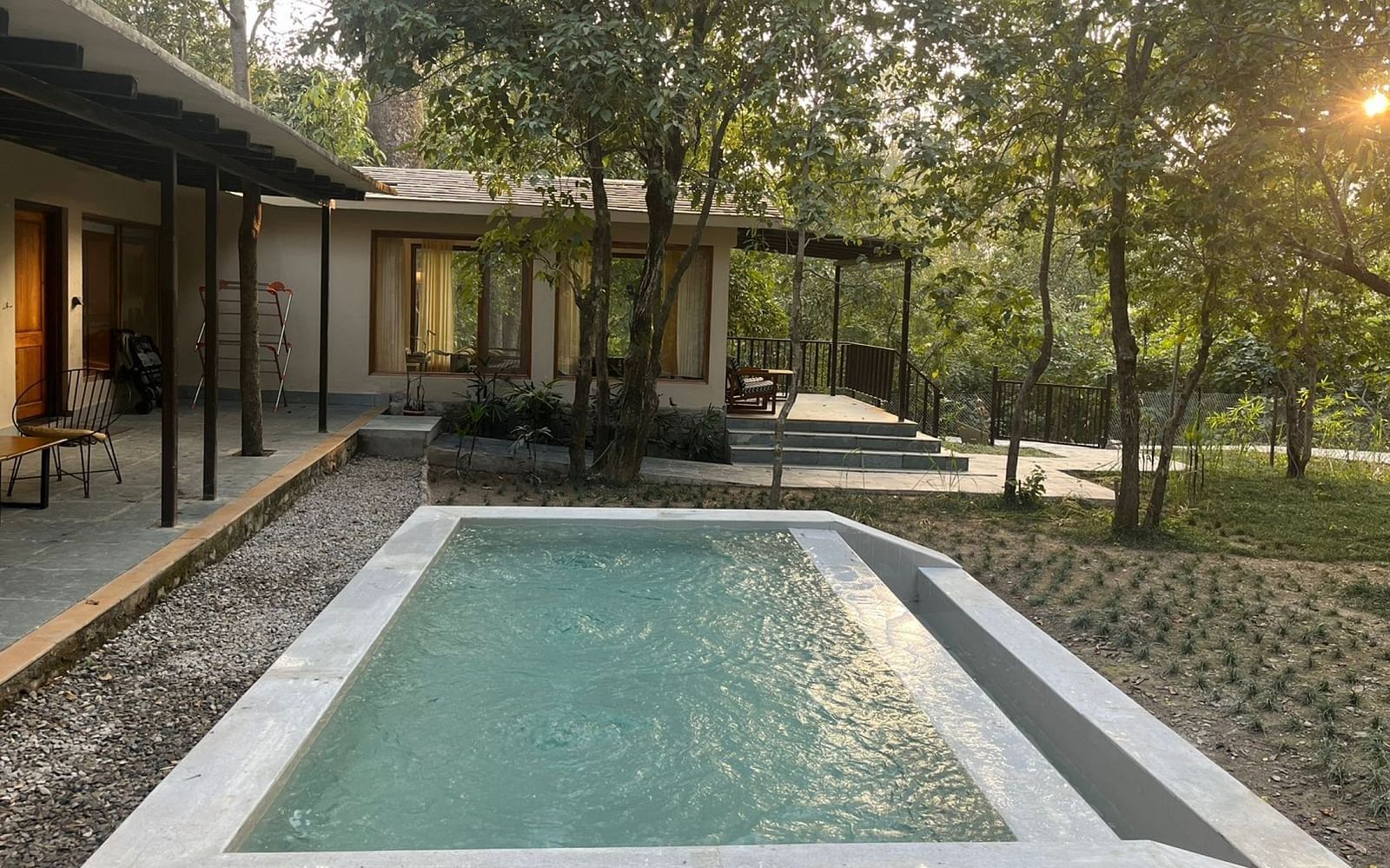 Sanctuary Suite at Saraca Resort & Spa Corbett with an outdoor plunge pool surrounded by paved stones and gardens