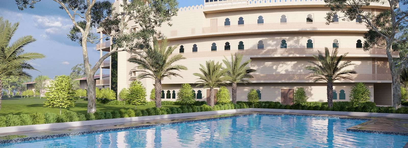 Bamboo Saa Sunrrise Wedding & Wellness Resort, Jaipur, with an outdoor swimming pool and sun loungers in a sunny setting.